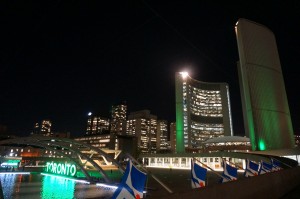 Nathan Phillips Square and Toronto CIty Hall in green for Mental Health Week