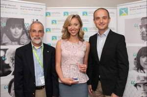 The Weather Network Director of programming Peter Bozinov and on-air personality Michelle MacKey accepted the CMHA Local Media Award from CMHA Toronto CEO Steve Lurie.